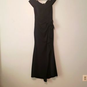 MOB sweep train. 95% poly. 5% spandex. Edge of shoulder neckline. Ruching waist.